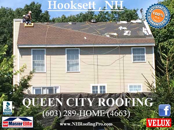 Queen City Roofing roofer on yellow home in Hooksett, NH